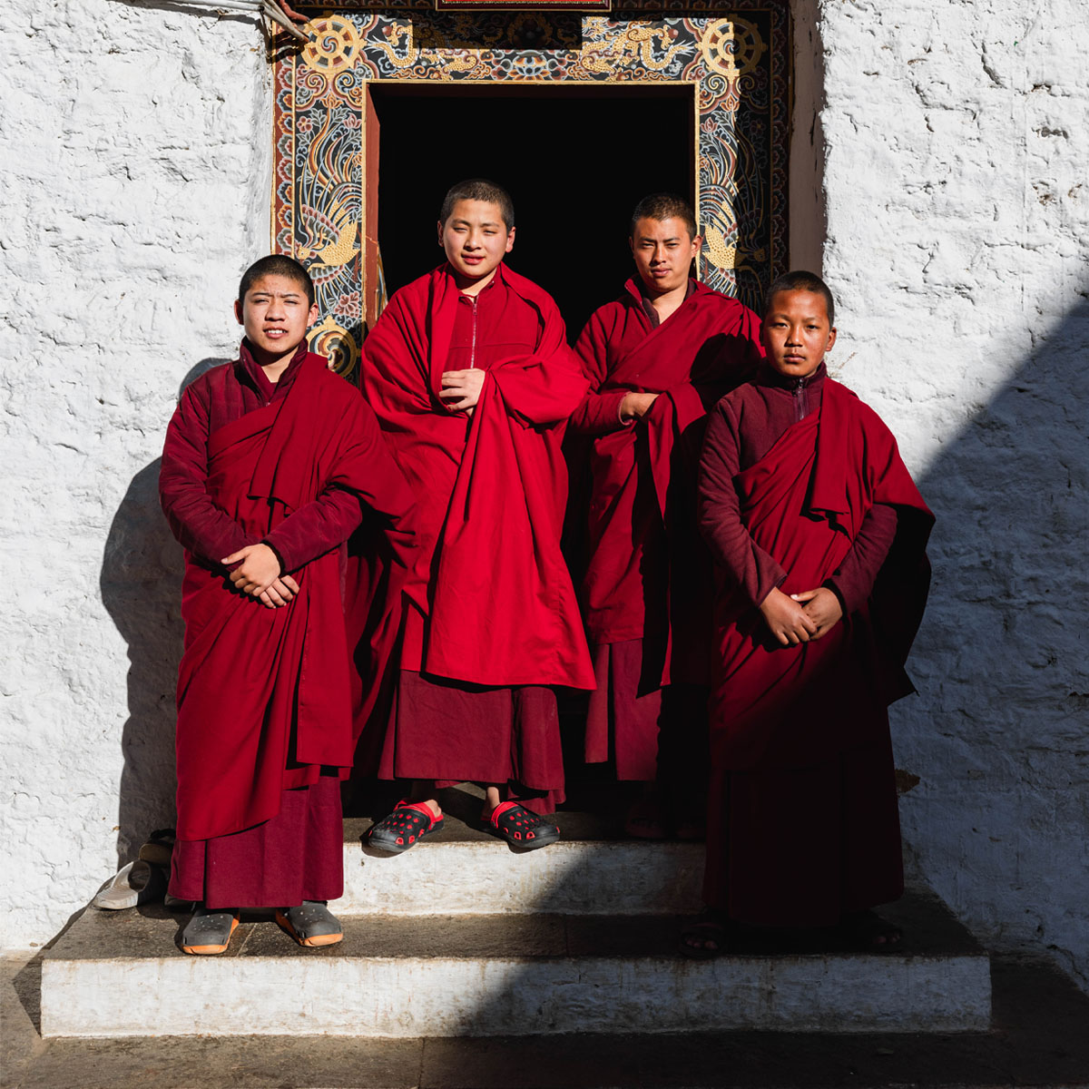 Young monks in crimson robes at a monastery