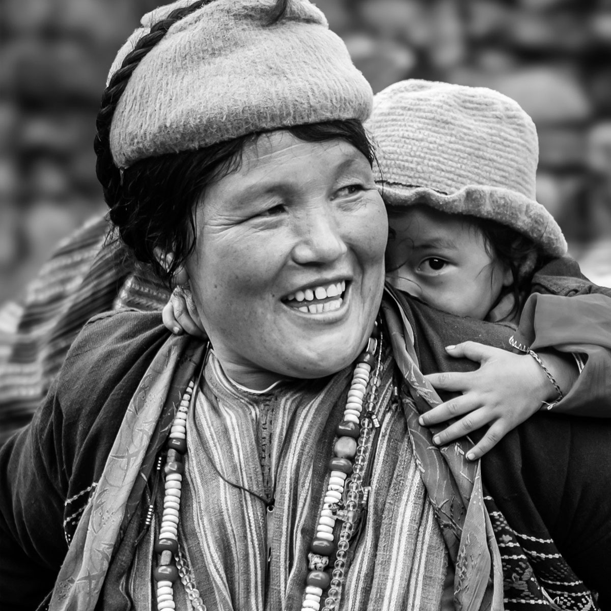 Portrait of a smiling Bhutanese elder in traditional dress