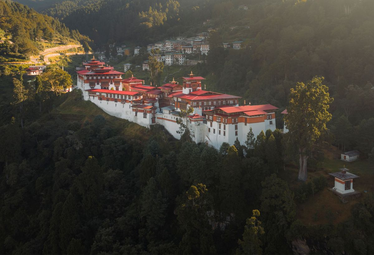 Trongsa Dzong spread along a ridge above forested valleys