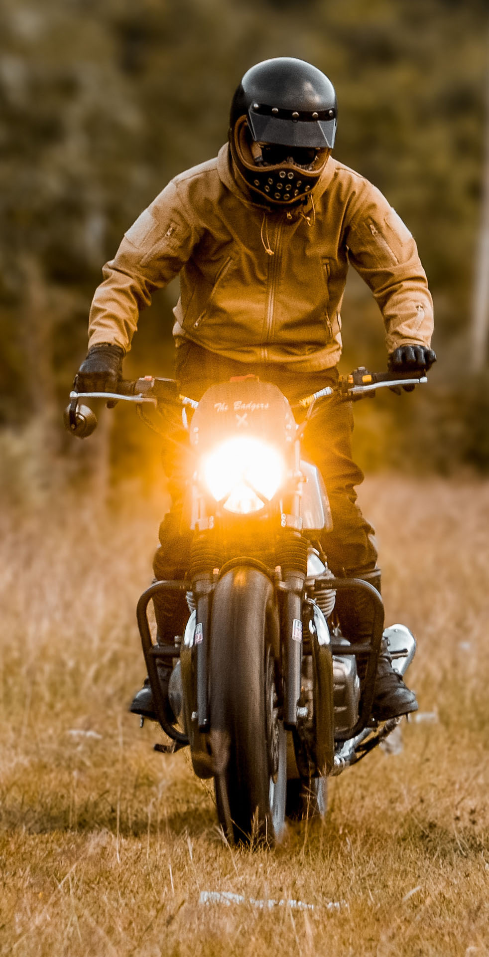 Motorbikers riding a winding Bhutanese mountain road