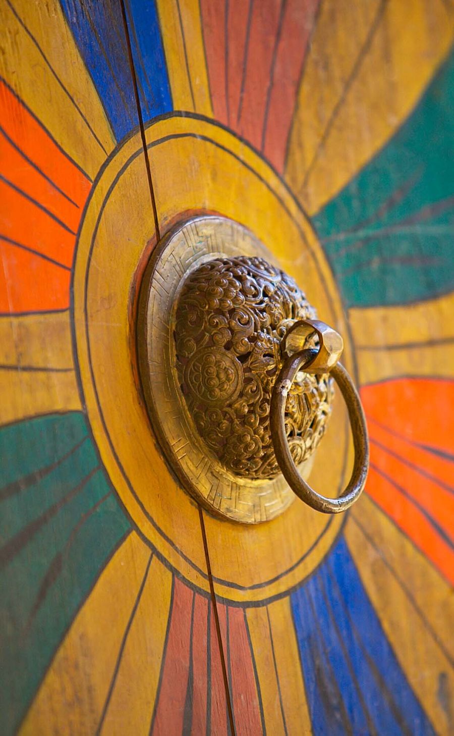 Gilded ring handle on a painted Bhutanese temple door