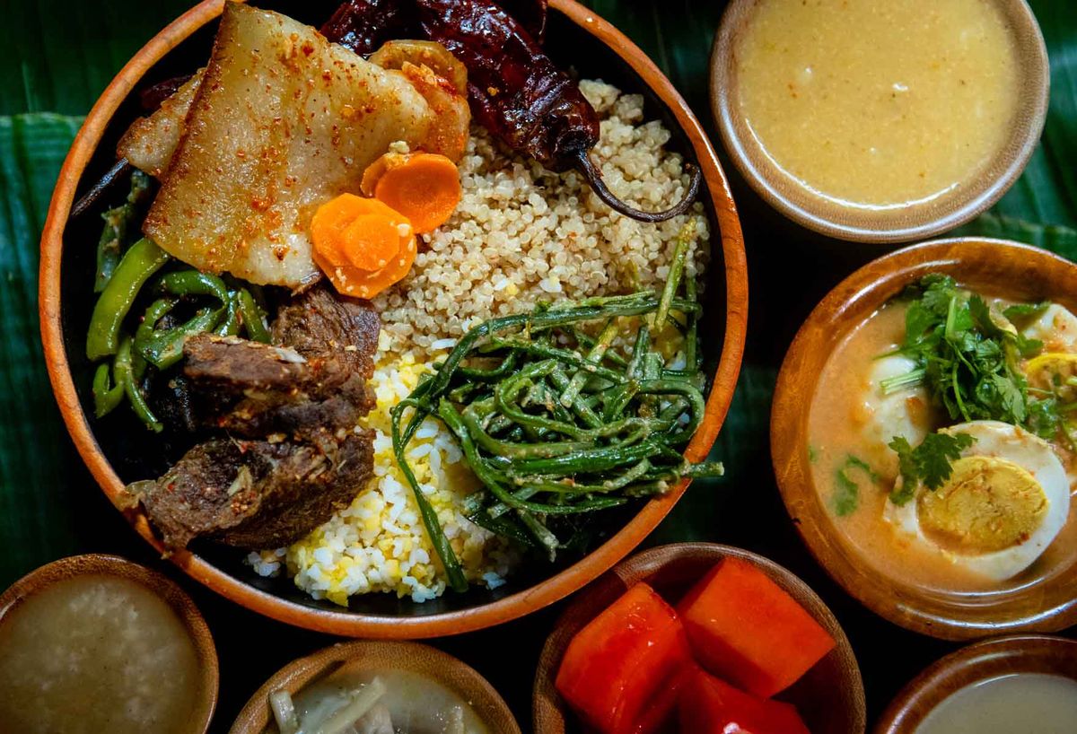 Bhutanese dishes served in wooden bowls, shot from above